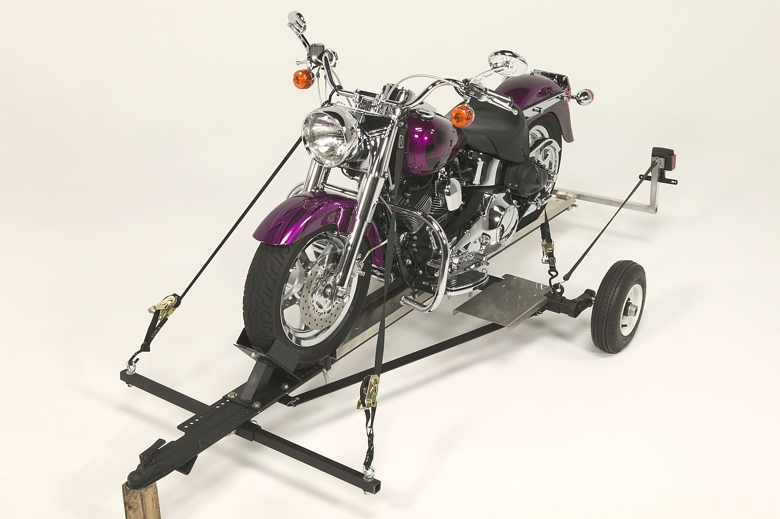 purple motorcycle loaded on port-a-chopper motorcycle transporter